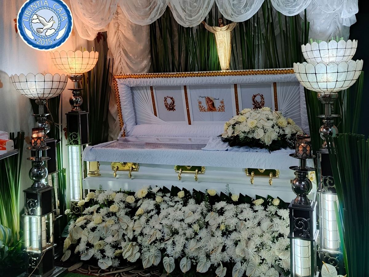 Wake setup by Libintia Caja with white drapes, capiz lamps and white flowers