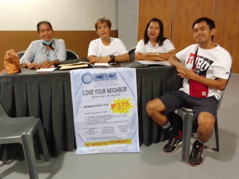 Libintia Caja team at a Love Your Neighbor Program booth